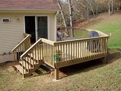 The tiny back deck was enlarged and connected to the rest of the deck. (225 KB)